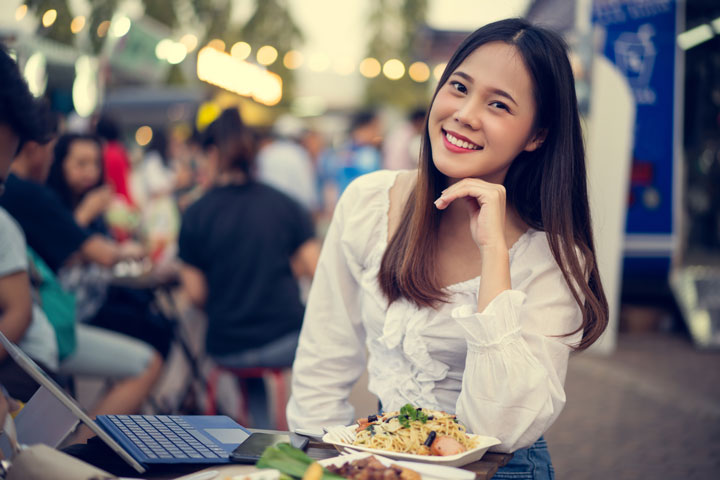 asian Korean woman eating street-food